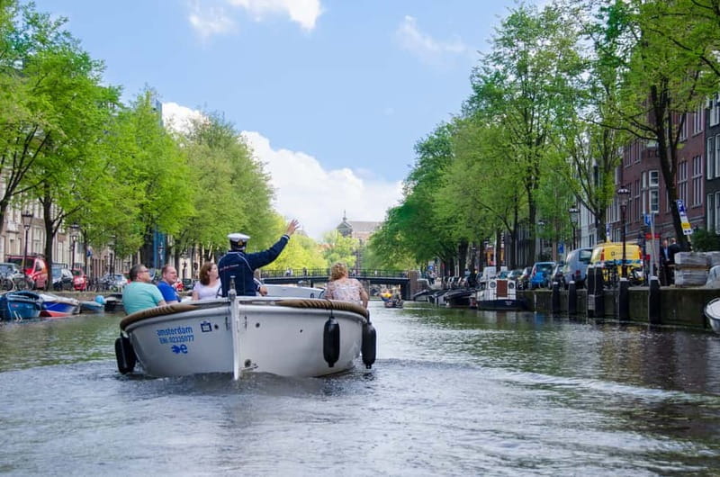 Amsterdam: 75 minute Open Boat Canal Cruise with Live Guide - From Leidseplein to Amsterdam’s canal belt