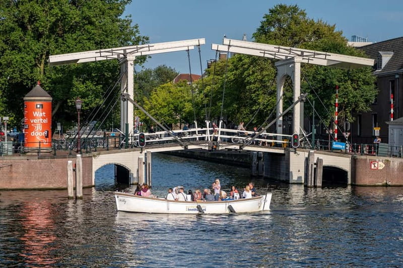 Amsterdam: 75 minute Open Boat Canal Cruise with Live Guide - Weather, comfort, and the best departure time
