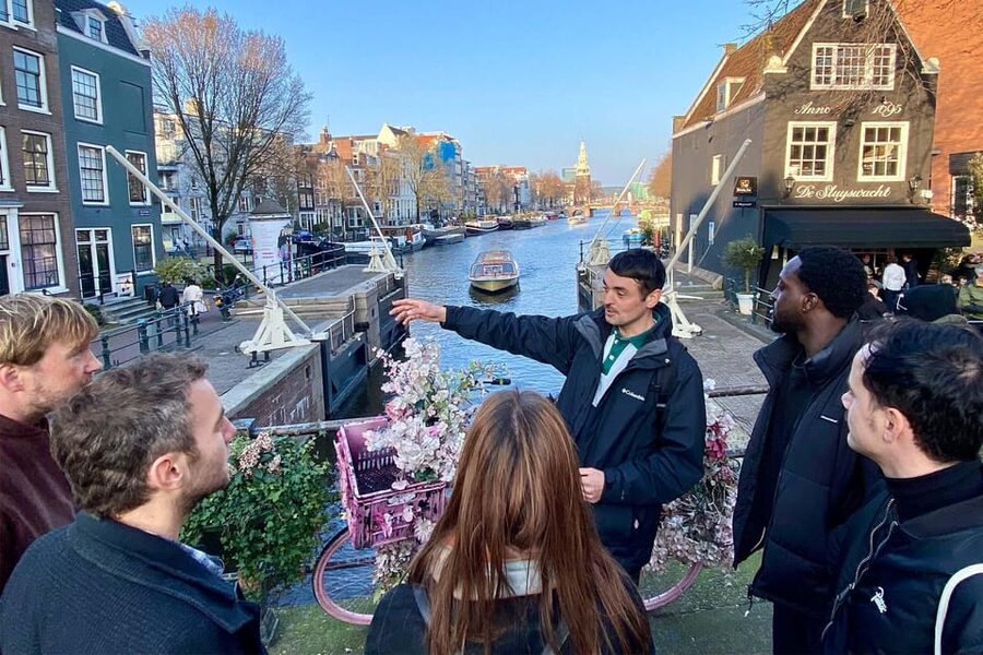 Amsterdam: Anne Frank Guided Small Group Walking Tour - Blauwburgwal brings the walk back to the city streets