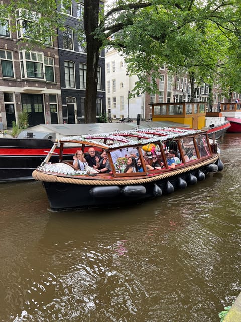 Amsterdam: Boat Tour with Optional Unlimited Drinks - Inside the boat: comfort, music, and smoke