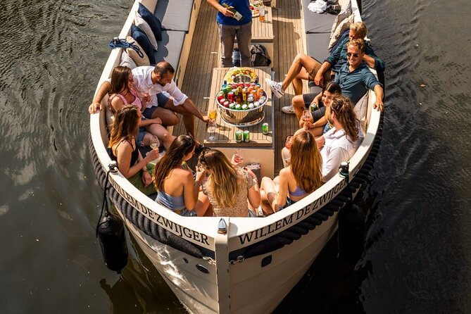Amsterdam: Canal Booze Cruise with Unlimited Drinks Option - Amstel River views from the boat