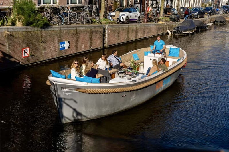 Amsterdam: Canal Cruise in Open Boat with Drink Option - Theater Carré, Magere Brug, and the eastern canals