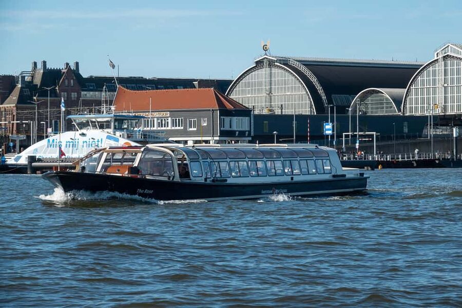 Amsterdam: Canal Cruise with Live Commentary & Audio Guide - The historic center and Western Church views