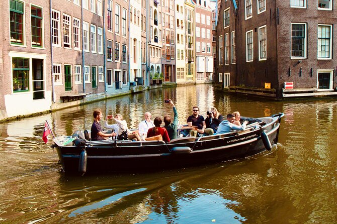 Amsterdam Canal Tour by Open Boat – 90 min Small Group Experience - De Waag and the compact side canals