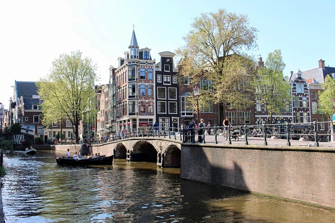 Amsterdam Canal Tour by Open Boat – 90 min Small Group Experience - Maritime Amsterdam and modern architecture