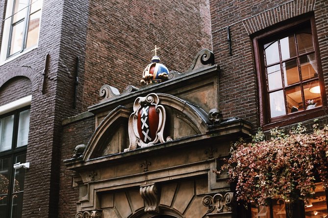 Amsterdam City Center Guided Walking Tour Semi-Private 12ppl Max - Narrow houses and the Dutch East India Company