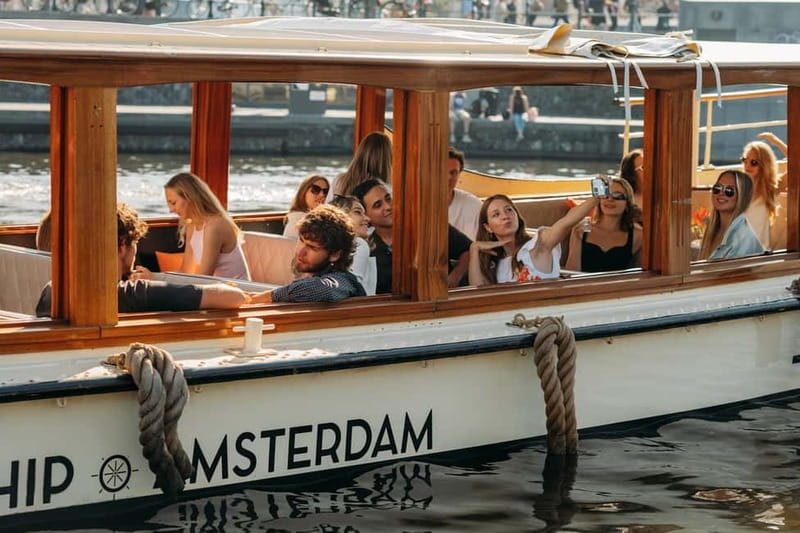 Amsterdam: Classic Boat Cruise with Optional Cheese & Wine - What the guide adds to the hour