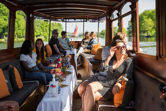 Amsterdam Classic Saloon Boat Cruise with Drinks and Cheese - Amstel, Carré, and the Skinny Bridge