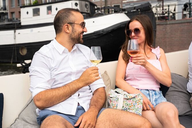 Amsterdam: Evening Candle Light Cruise With Wine & Cheese - Damrak’s crooked houses and Herengracht