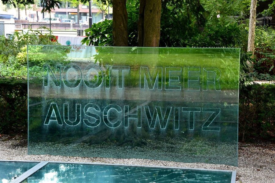Amsterdam: Guided Anne Frank Small-Group Walking Tour - Broken reflections at the Auschwitz Memorial
