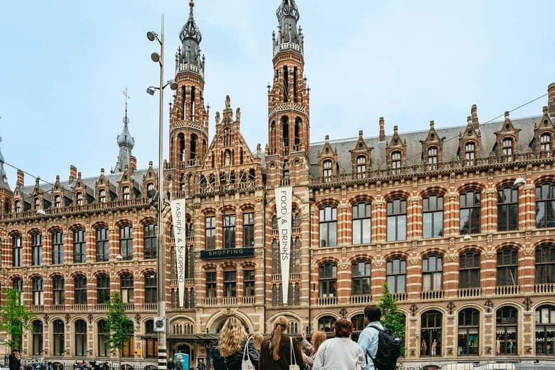 Amsterdam: Guided Cultural Walking Tour - Starting beneath the white pillar at Dam Square