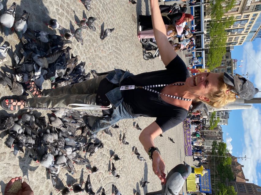 Amsterdam: Guided Off-The-Beaten-Track Walking Tour - Torensluis and the canal belt story