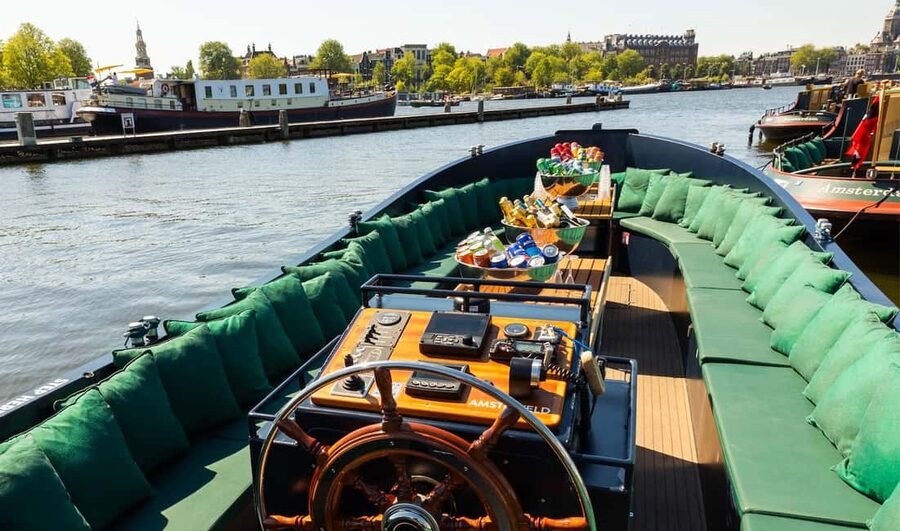 Amsterdam: Guided Open Boat Canal Cruise Including Drink - One drink or unlimited drinks?