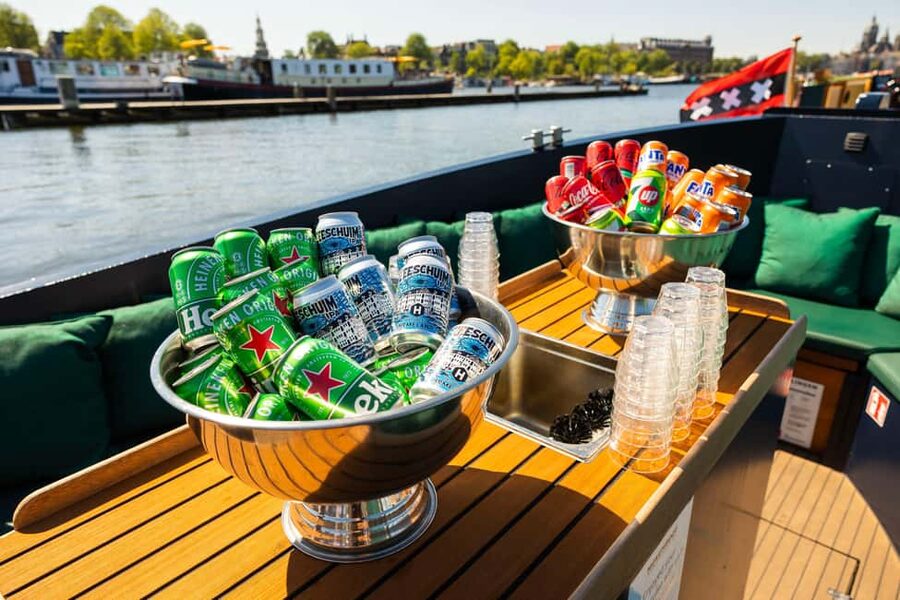 Amsterdam: Guided Open Boat Canal Cruise Including Drink - Setting off beside Amsterdam Centraal Station