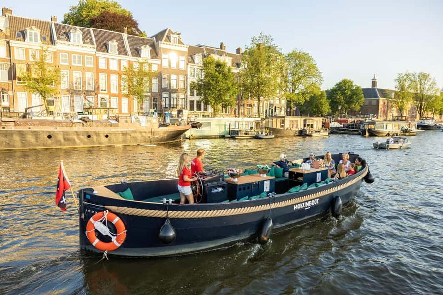 Amsterdam: Guided Open Boat Canal Cruise Including Drink - From the station to the old harbor