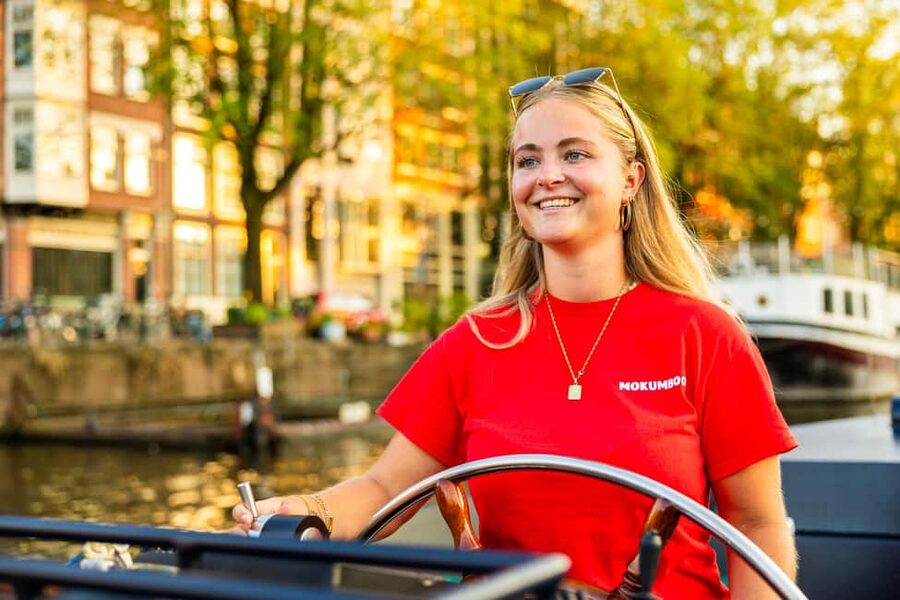 Amsterdam: Guided Open Boat Canal Cruise Including Drink - Rembrandt, Waterlooplein, and the Amstel