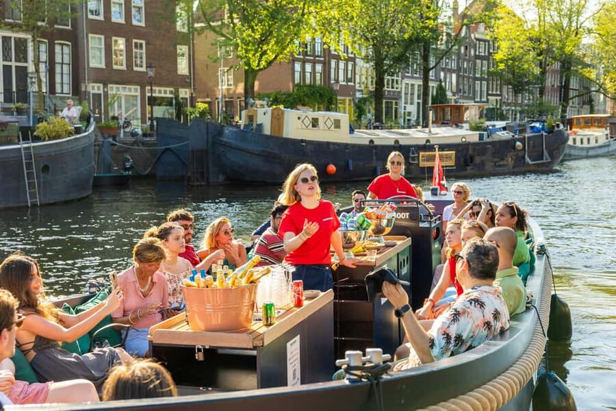 Amsterdam: Guided Open Boat Canal Cruise Including Drink - Canal houses, seven bridges, and the elegant belt
