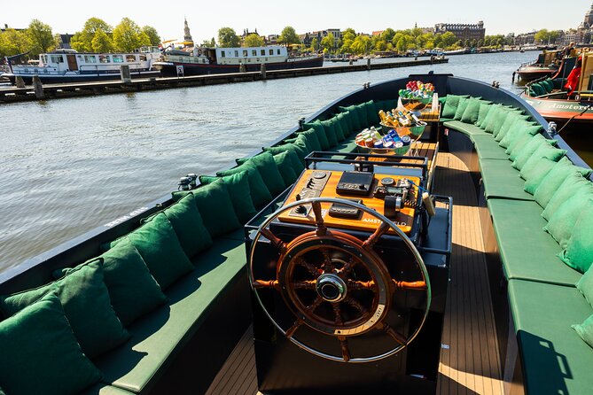 Amsterdam: Guided Open Boat Canal Cruise Unlimited Drinks Option - Key things to know before boarding