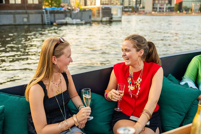 Amsterdam: Guided Open Boat Canal Cruise Unlimited Drinks Option - Rembrandt, opera, and the Waterlooplein area