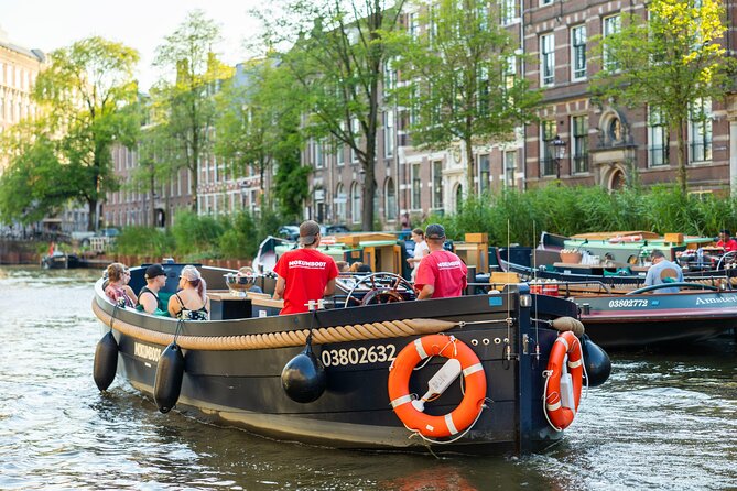 Amsterdam: Guided Open Boat Canal Cruise Unlimited Drinks Option - The Nine Streets, Keizersgracht, and houseboat life