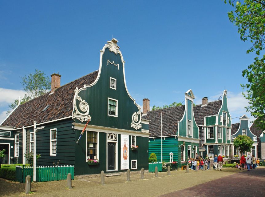 Amsterdam: Guided Zaanse Schans, Windmills & Cheese Tour - Returning to Amsterdam by comfortable coach