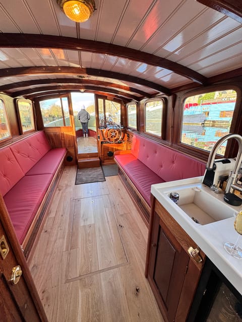 Amsterdam: Historic Boat Cruise with open bar and nibbles - Rain or shine, with two ways to sit