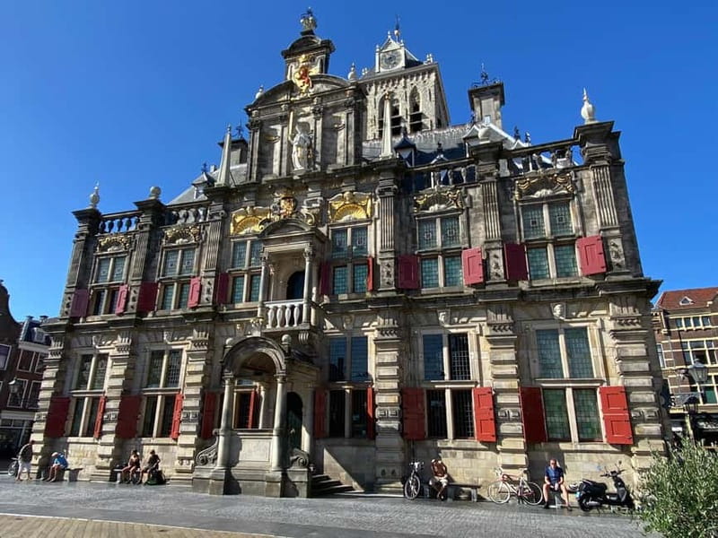 Amsterdam: Kinderdijk, Euromast, Delft and Den Haag Day Tour - What the guide adds to the day