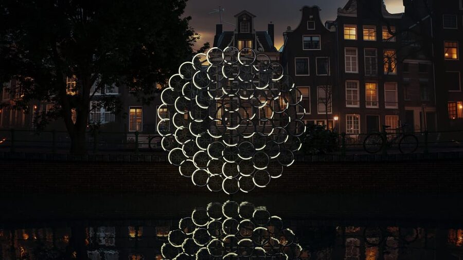 Amsterdam: Light Festival Boat Tour with Warm Drinks - Why seeing Amsterdam from the water changes the festival