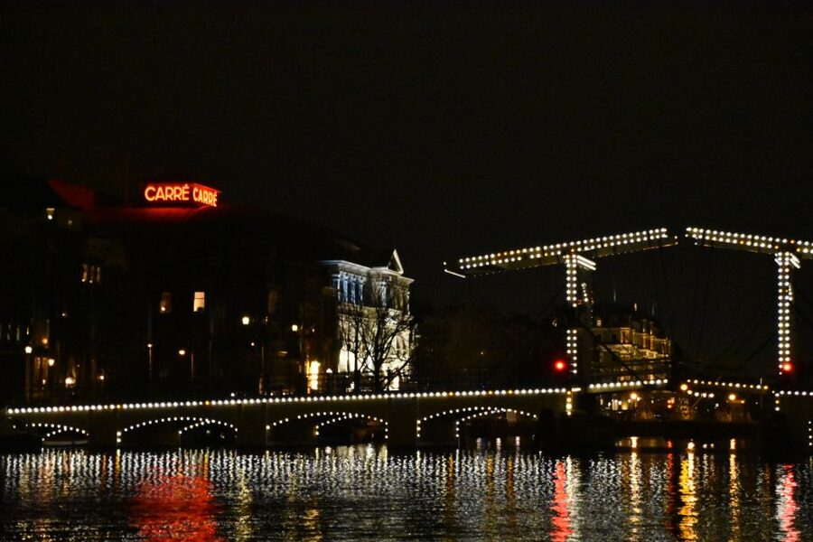 Amsterdam: Light Festival Heated Cruise with Drinks & Snacks - Waterlooplein and the turn toward Magere Brug