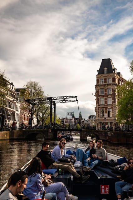 Amsterdam:Old City Canal Cruise with Live Guide and Open Bar - Anne Frank House, Westerkerk, and Jordaan views