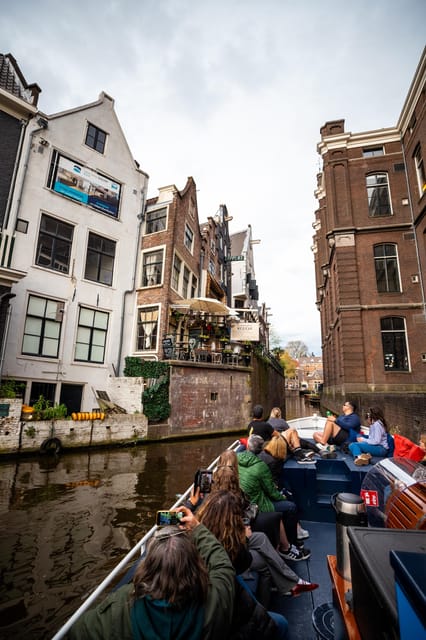 Amsterdam:Old City Canal Cruise with Live Guide and Open Bar - Sunset, comfort, and seating choices