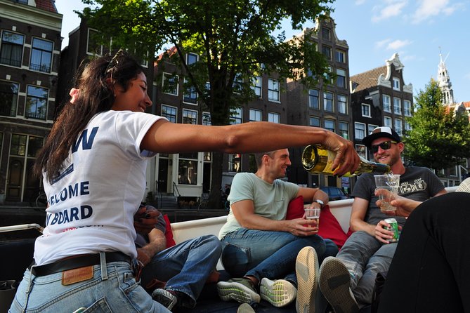 Amsterdam Open Boat Cruise in Old City Center with Live Guide - What the one-hour route gives you