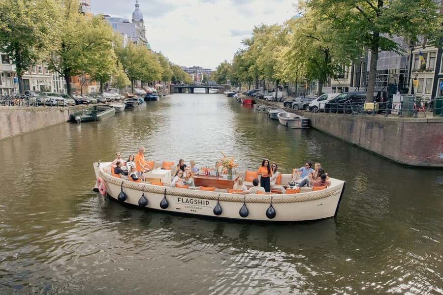 Amsterdam: Open Boat Cruise option Unlimited Drinks & Bite - Grachtengordel and waterside neighborhoods