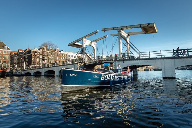 Amsterdam Open Boat Cruise with Live Guide and Two Drinks - Open air in summer, covered in colder weather
