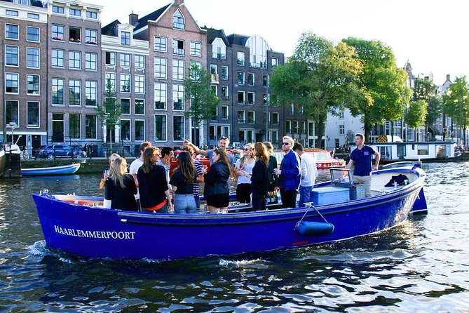 Amsterdam Open Boat Sightseeing Canal Cruise - Amstel Hotel and the river setting