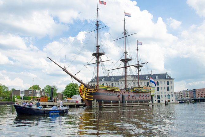 Amsterdam Open Boat Sightseeing Canal Cruise - NEMO, Amsterdam Centraal, and modern city views