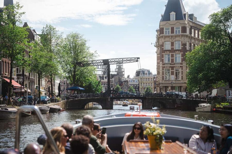 Amsterdam: Open Boat Tour of Canals with Expert Local Guide - The flower cocktail and what is not included