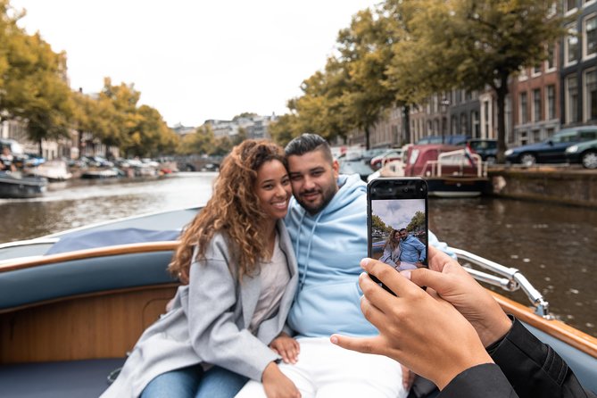 Amsterdam Open Boat Tour with Local Guide - A captain who also guides the ride