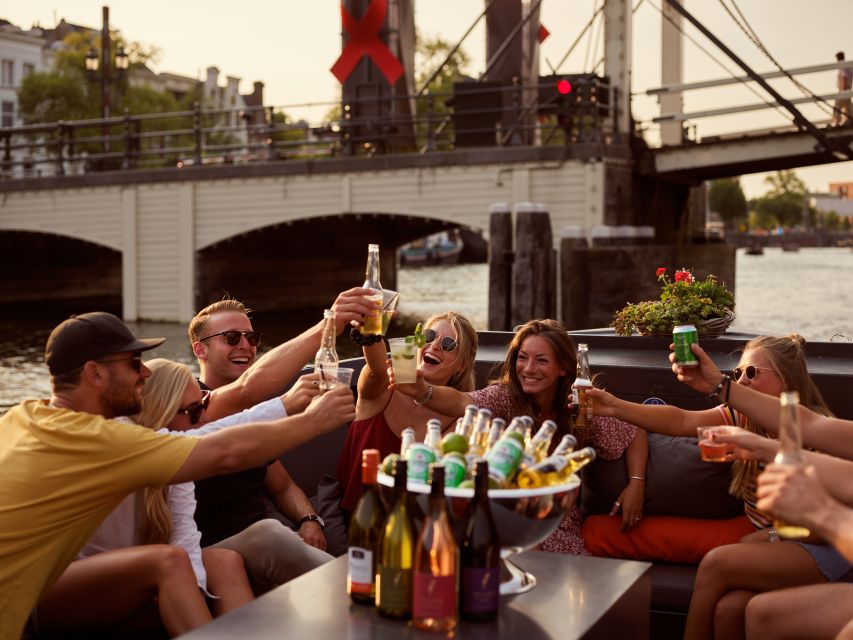 Amsterdam: Private BBQ Cruise with Personal Chef & Drinks - A private boat with Amsterdam as the backdrop
