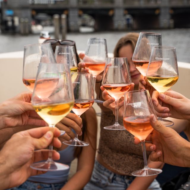Amsterdam: Private Canal Booze Cruise with Unlimited Drinks - The Red Light District from the canal