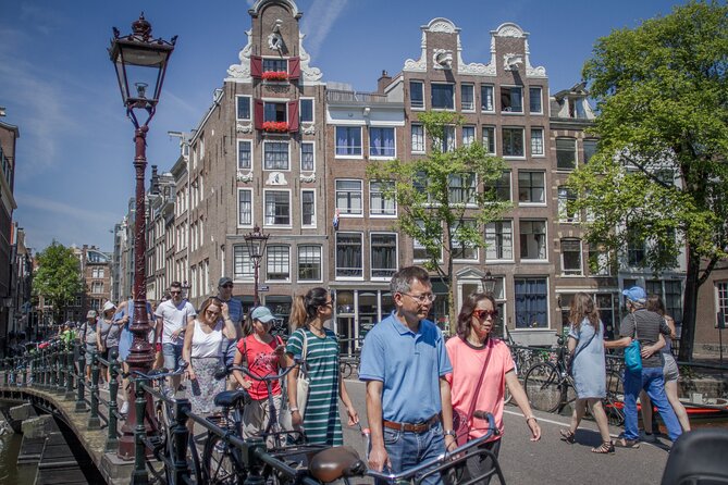 Amsterdam Private Historical Walking Tour - The Royal Palace and New Church in a quick first chapter