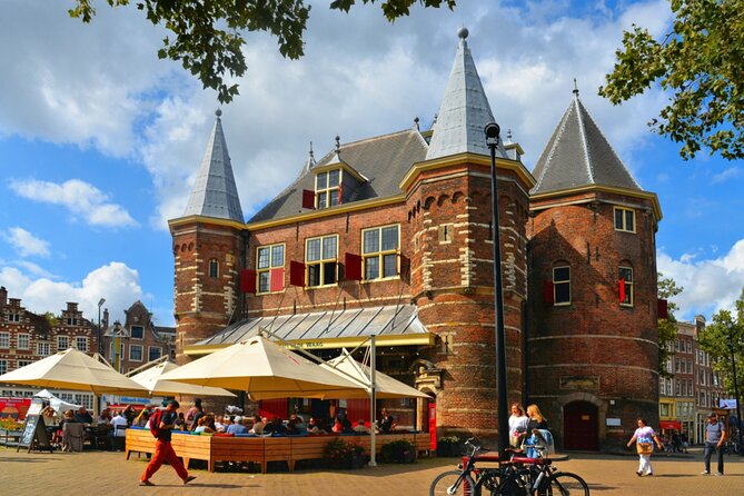 Amsterdam Red Light District Treasure: Self-Guided Tour & Quest - Meeting Montelbaanstoren beside the Oude Schans canal