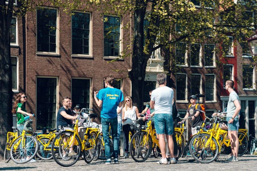 Amsterdam: Relaxed City Highlights Guided Bike Tour - Starting near Central Station and learning the rules