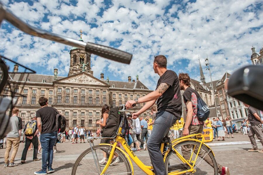 Amsterdam: Relaxed City Highlights Guided Bike Tour - Leidseplein, music, squatting, and crime