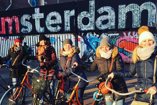 Amsterdam's Hidden Gems and Street Art Bike Tour - Returning by ferry beside Central Station