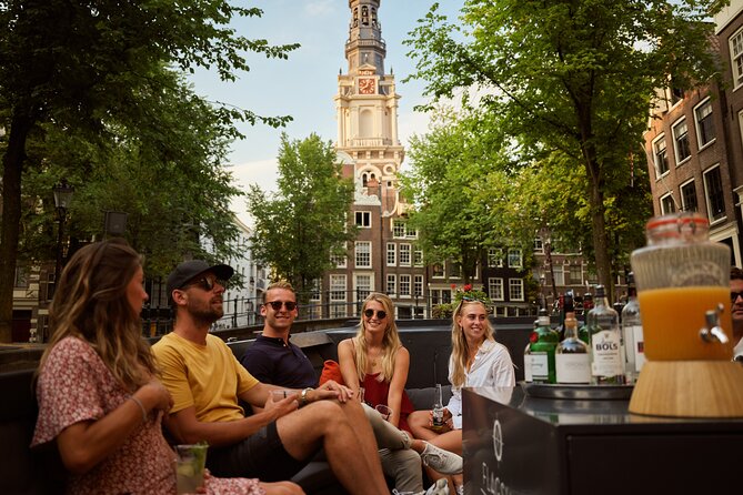 Amsterdam: Saloon Boat Cruise + Unlimited Drinks & Bite option - Zuiderkerk and the city skyline