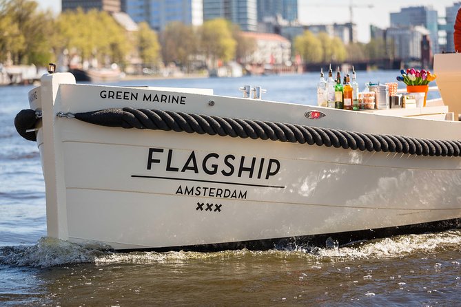 Amsterdam: Saloon Boat Cruise + Unlimited Drinks & Bite option - The Drunken Houses and Amsterdam’s tilted façades