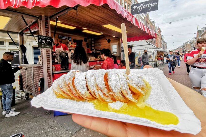 Amsterdam: Self-Guided Food Tour in De Pijp Neighbourhood - Herring and kibbeling at the family fish stall