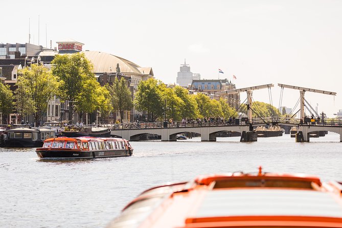 Amsterdam Sightseeing Canal Cruise with Audio Guide - Bridges, the Amstel, and Amsterdam’s working waterfront