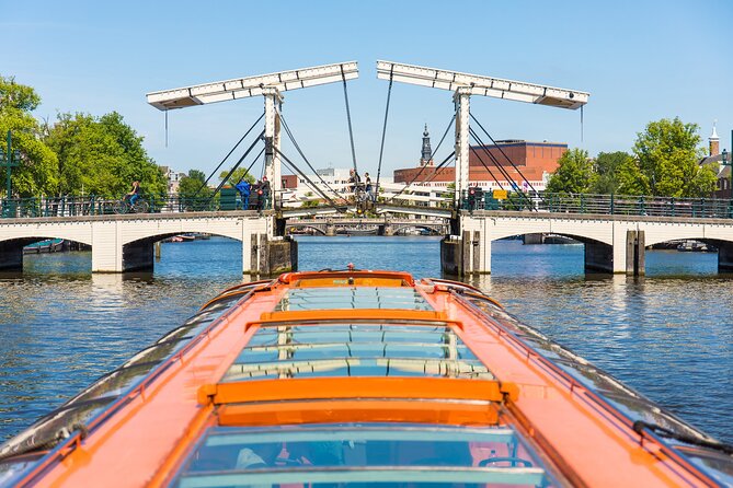 Amsterdam Sightseeing Canal Cruise with Audio Guide - Evening lights, winter comfort, and weather choices